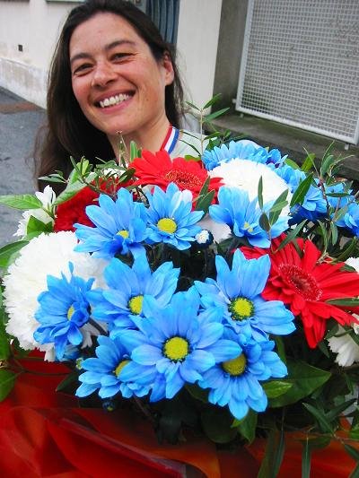 Carla with her Red White Blue bouquet and medal